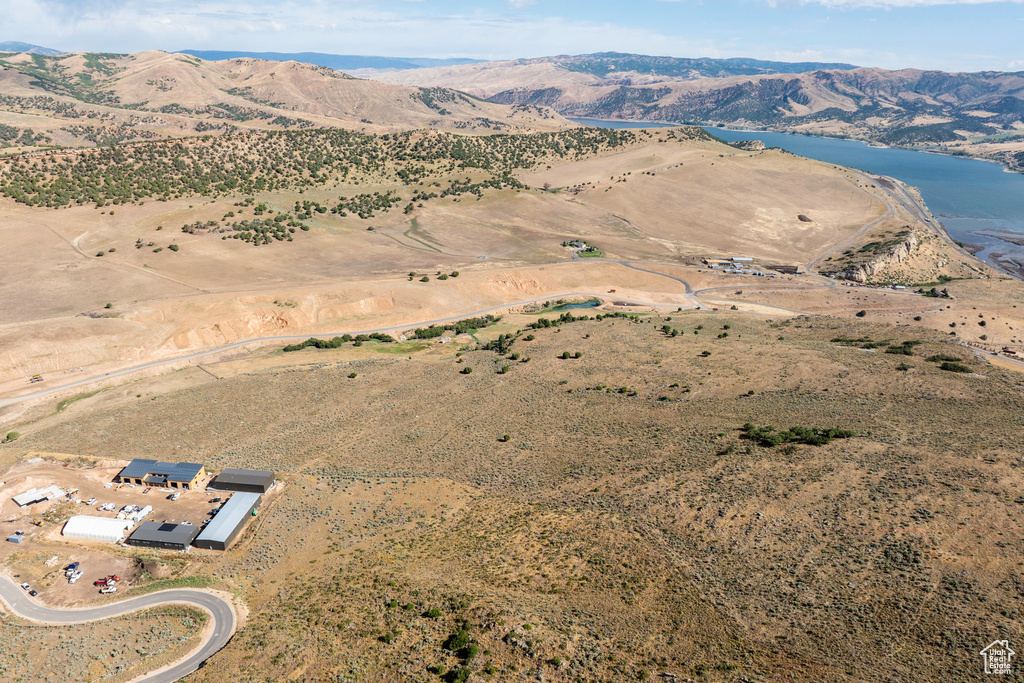 View of property location with a water and mountain view