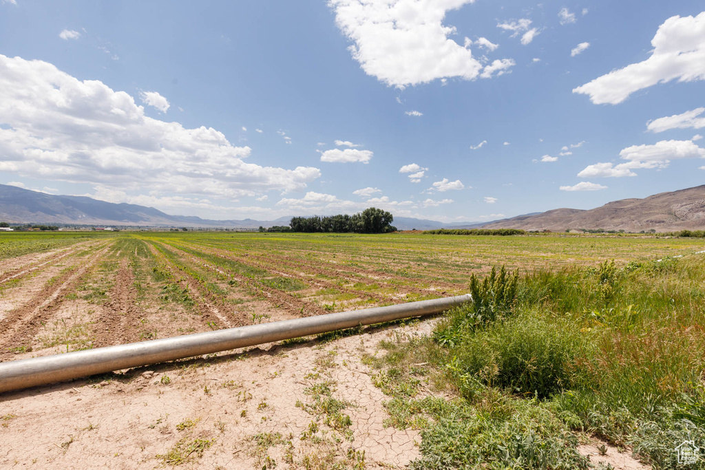 View of street featuring a mountain view and a view of rural / pastoral area