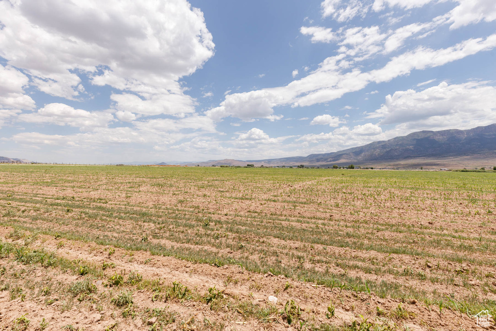 View of mountain backdrop featuring rural landscape