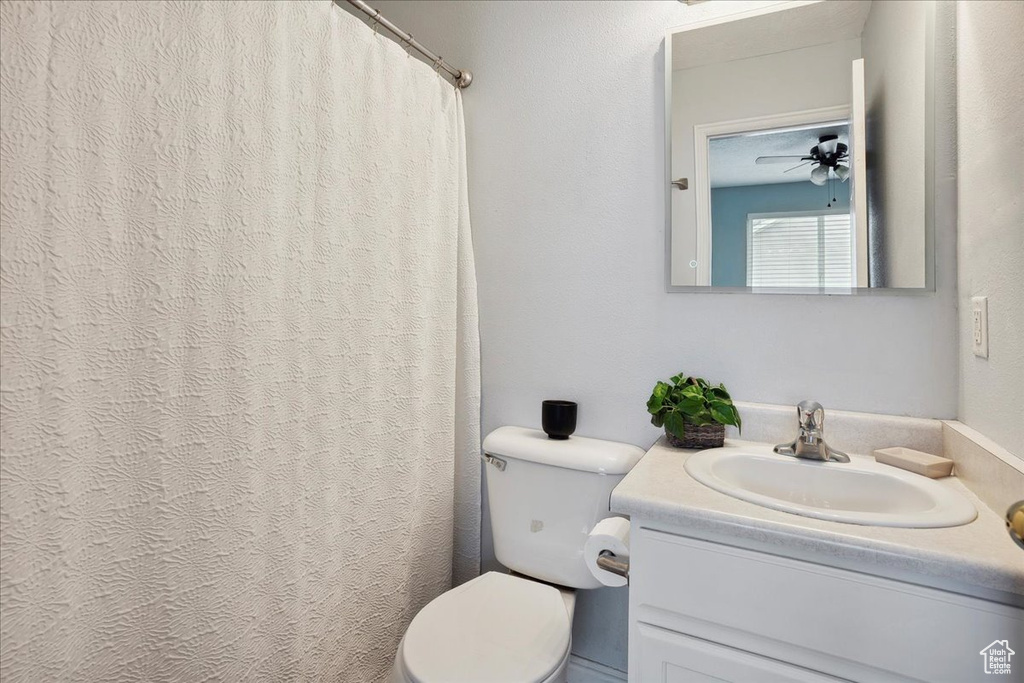 Full bath with vanity and curtained shower