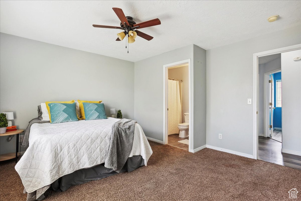 Bedroom featuring carpet floors, ensuite bath, and ceiling fan