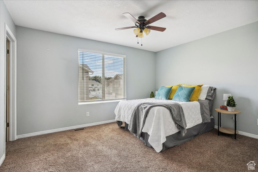Bedroom with carpet and a ceiling fan
