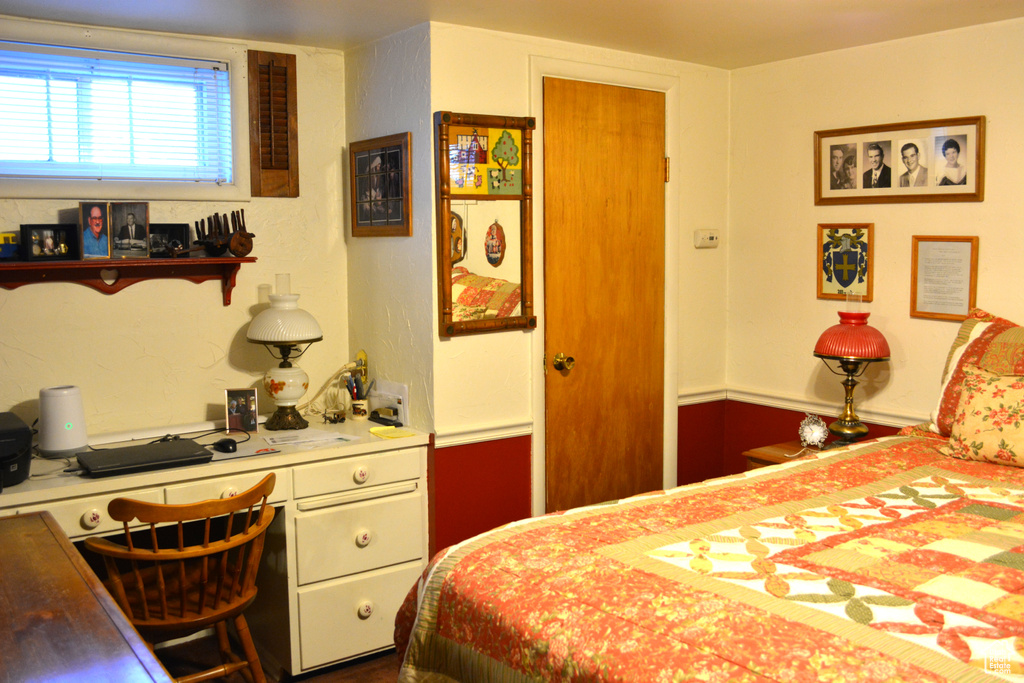 Bedroom featuring built in desk