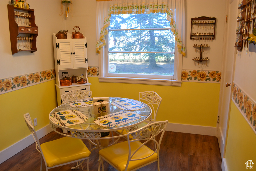Dining area with wood finished floors