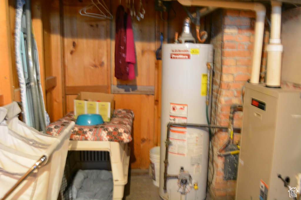 Utility room featuring water heater