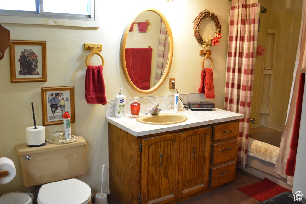 Bathroom with vanity and shower / bath combination with curtain