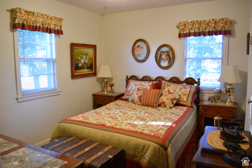 Bedroom with multiple windows