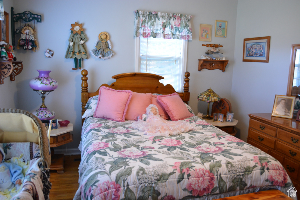 Bedroom with wood finished floors