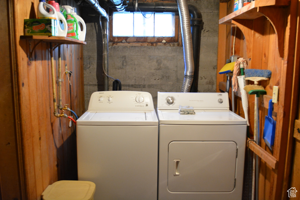 Washroom featuring washing machine and dryer