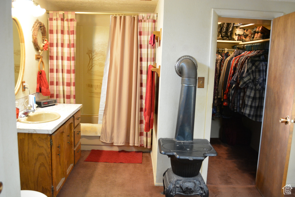 Full bathroom with vanity and shower / tub combo with curtain
