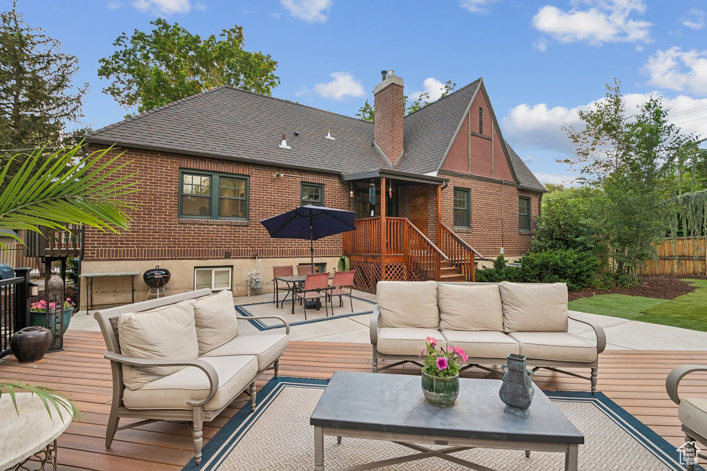 Deck with an outdoor hangout area and outdoor dining area