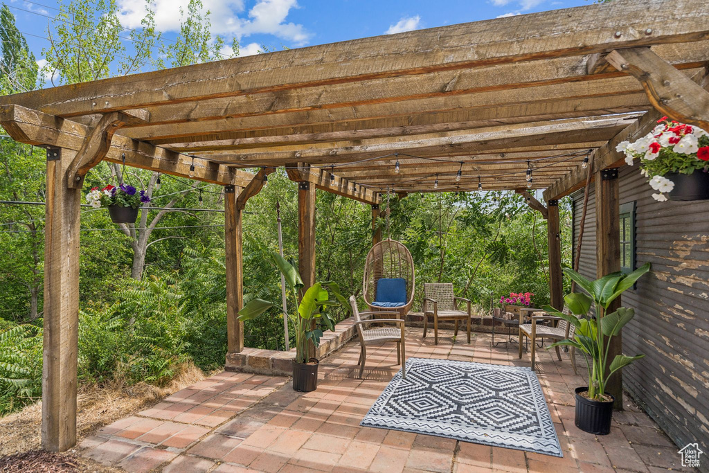 View of patio with a pergola