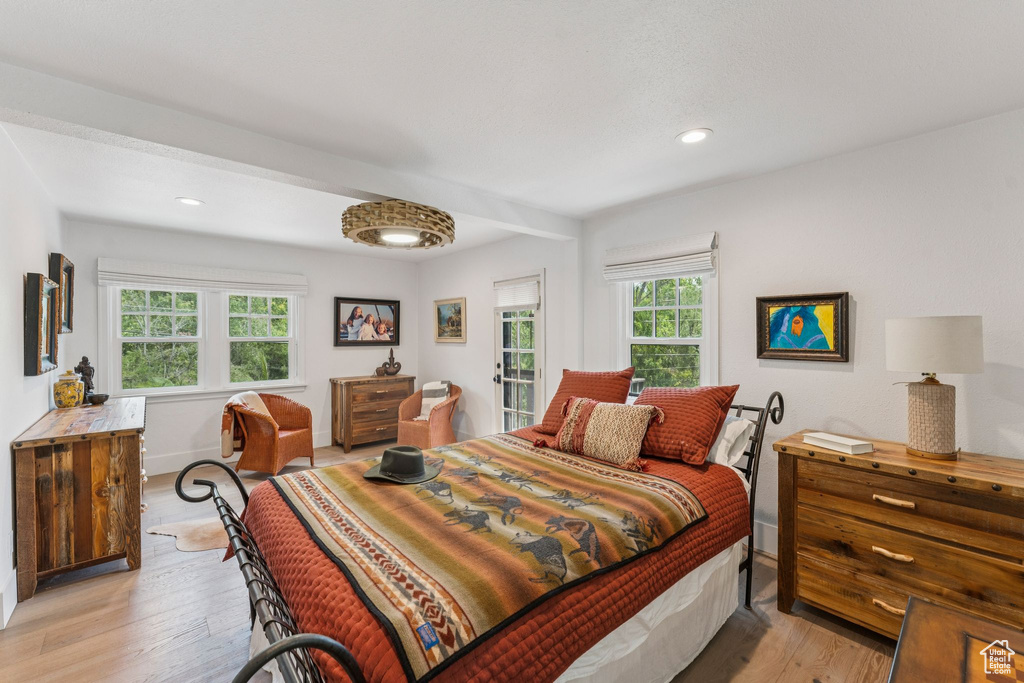 Bedroom featuring light wood-style floors and recessed lighting