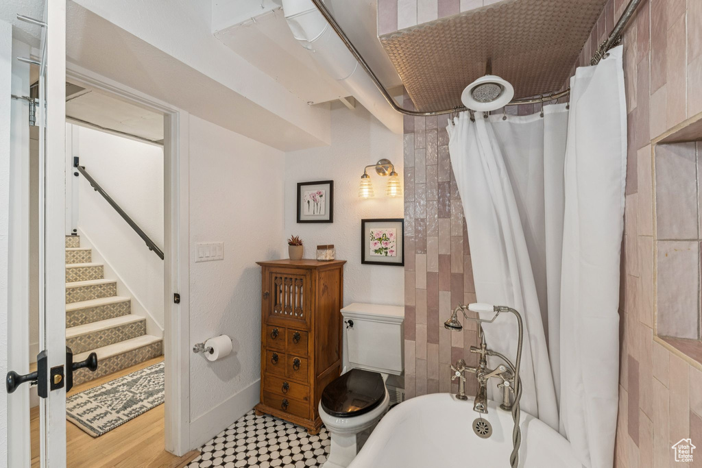 Full bathroom featuring toilet