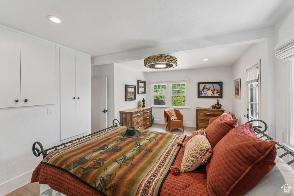 Bedroom with recessed lighting and light wood-style floors