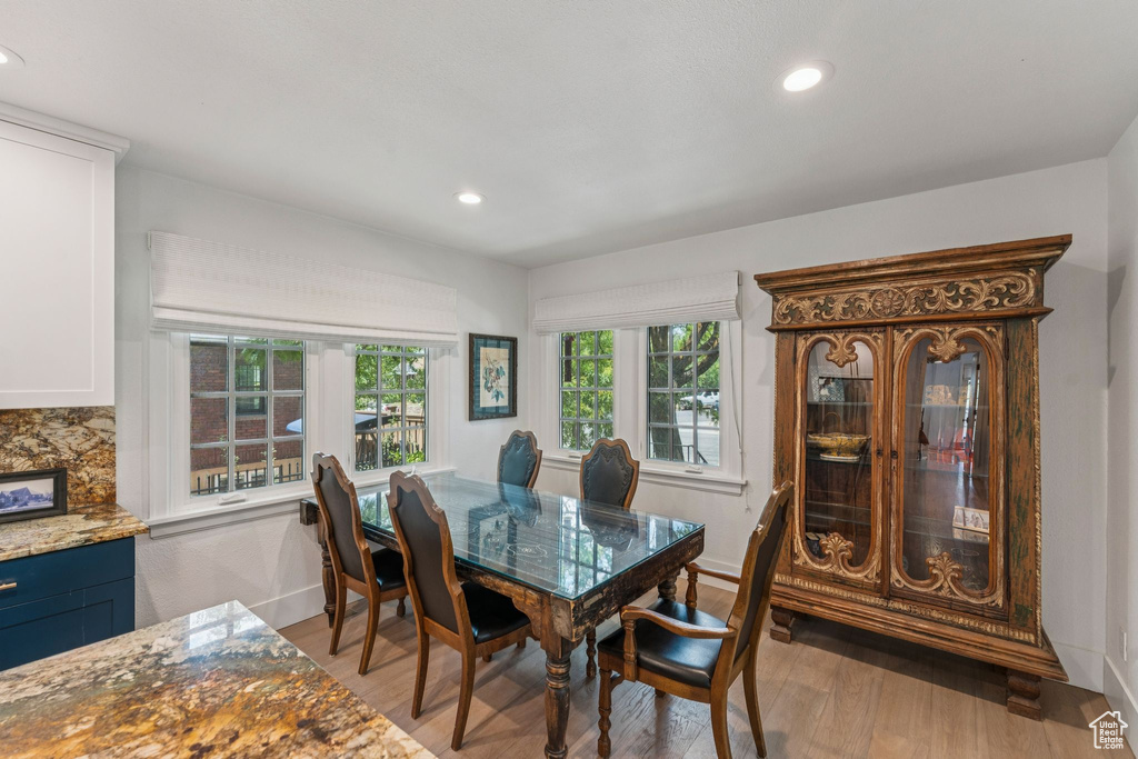 Dining room featuring light wood-style floors and recessed lighting