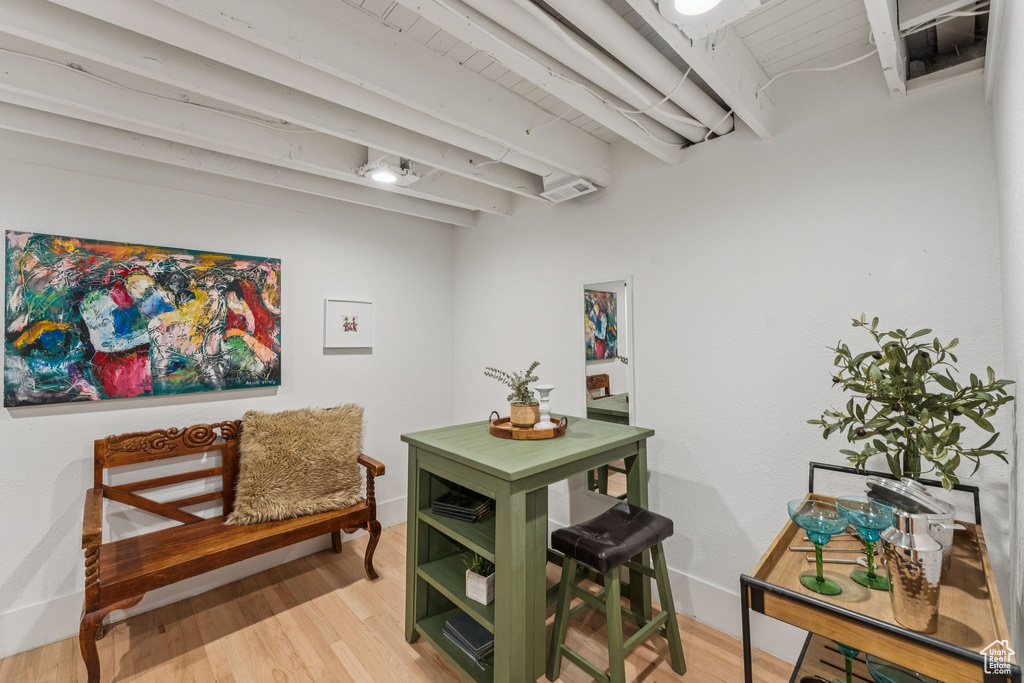 Detailed view of wood finished floors and beamed ceiling