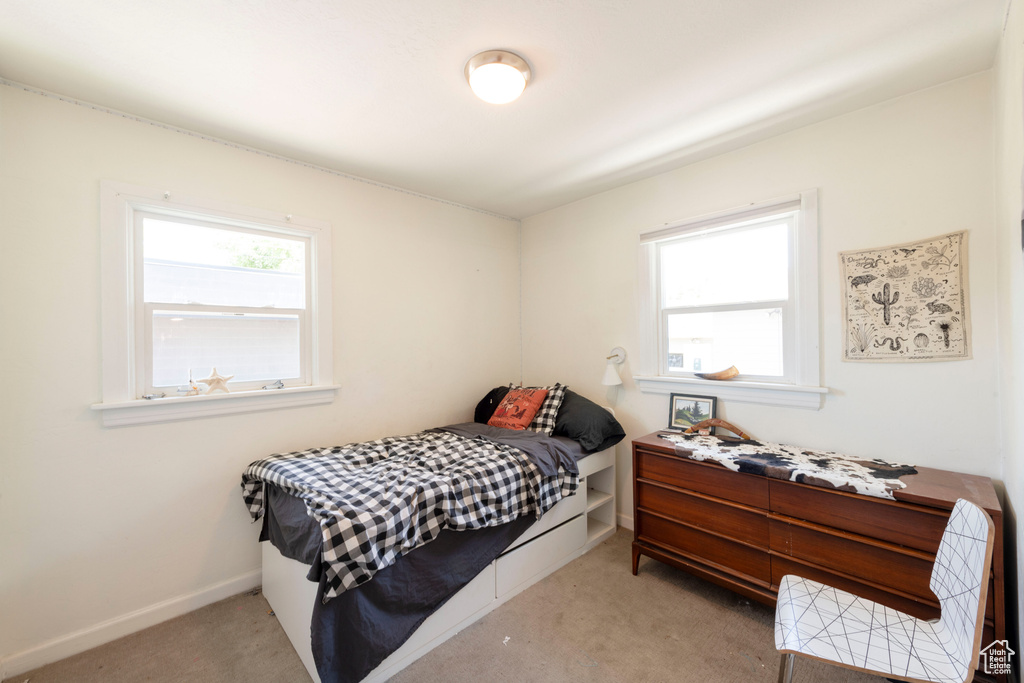 Carpeted bedroom with baseboards