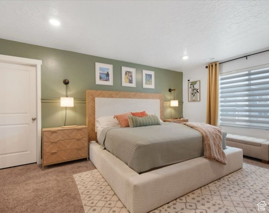 Carpeted bedroom featuring recessed lighting