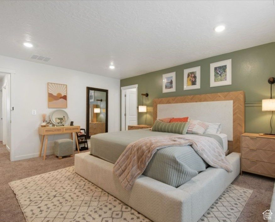 Bedroom with carpet floors, recessed lighting, and baseboards