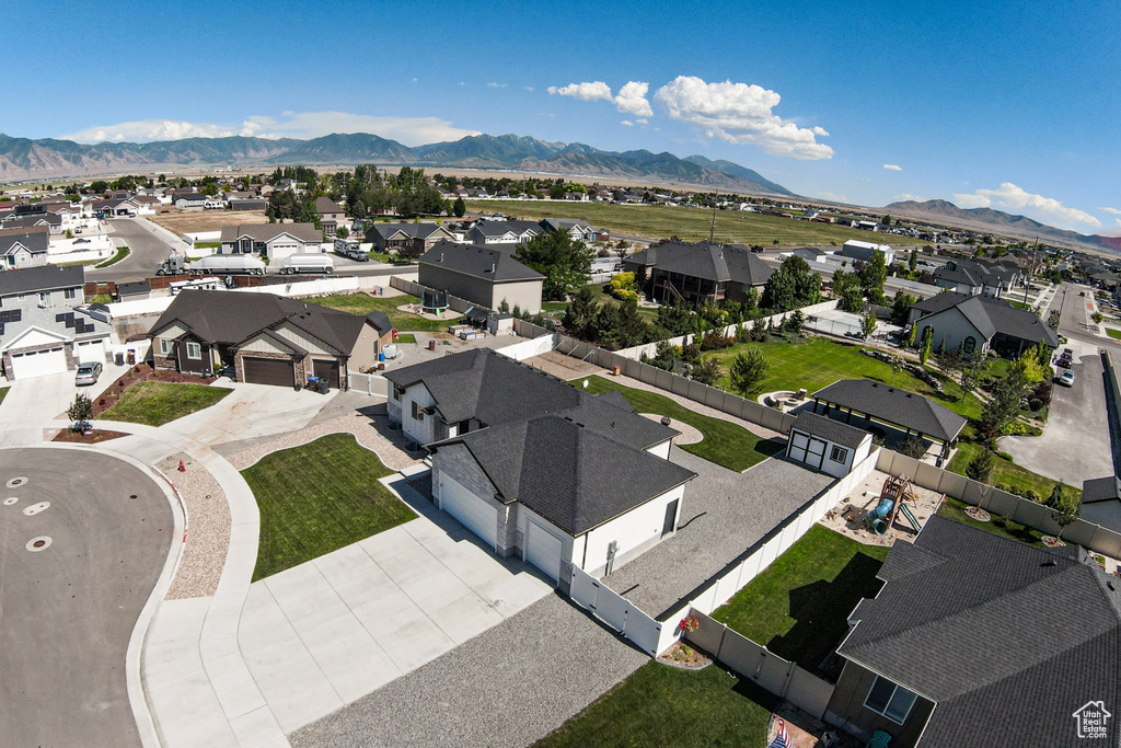 Aerial view of residential area featuring a mountain backdrop