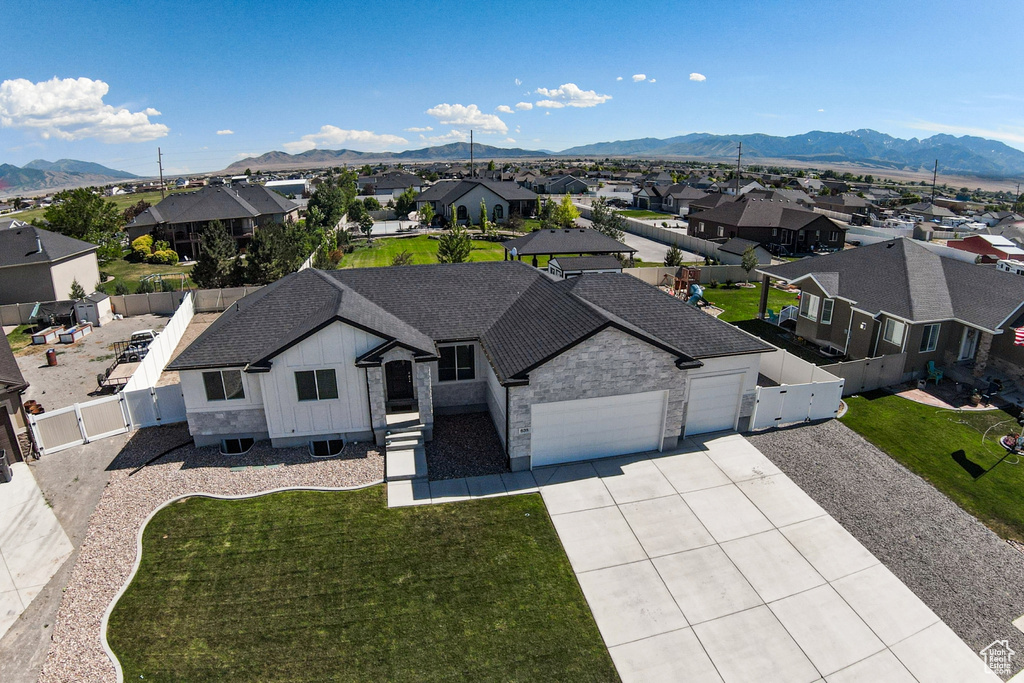 Aerial view of residential area featuring mountains