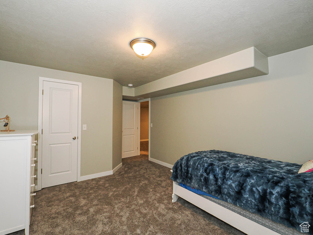 Carpeted bedroom with baseboards