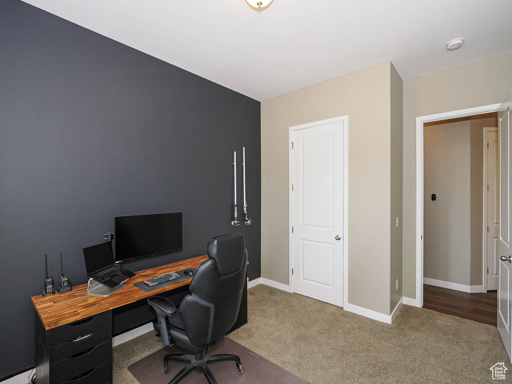 Office featuring carpet and baseboards