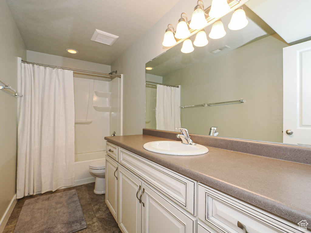Full bathroom featuring vanity, shower / tub combo, tile patterned flooring, and recessed lighting