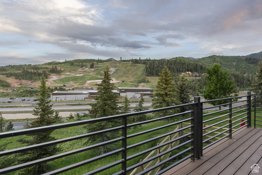Wooden deck featuring a mountain view