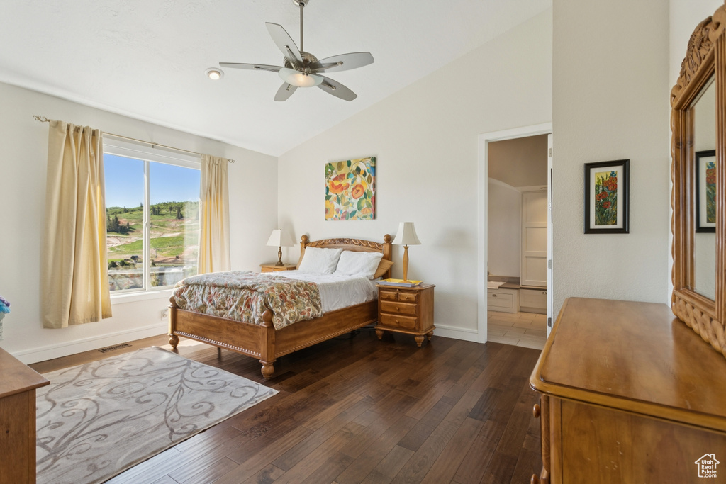 Bedroom featuring dark wood-style flooring, high vaulted ceiling, and a ceiling fan