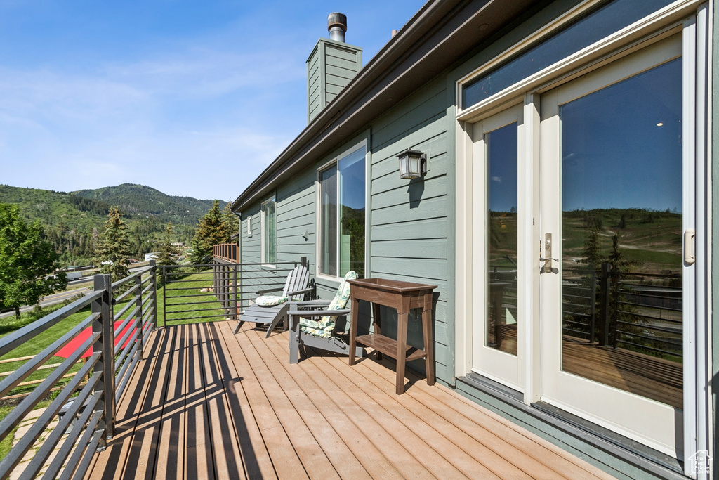 Wooden deck featuring a mountain view
