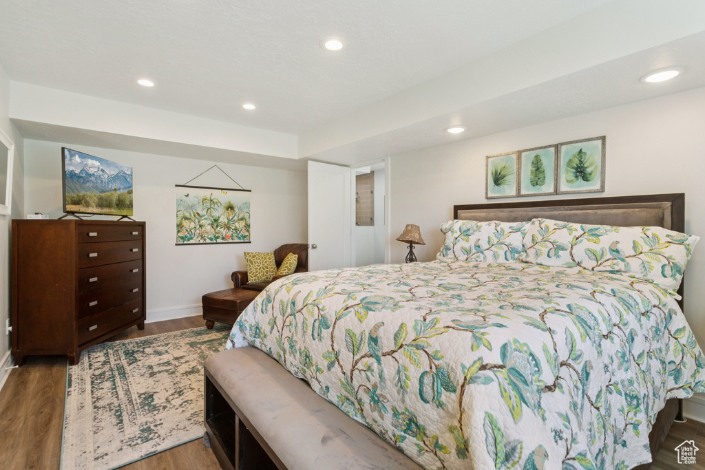 Bedroom featuring wood finished floors and recessed lighting