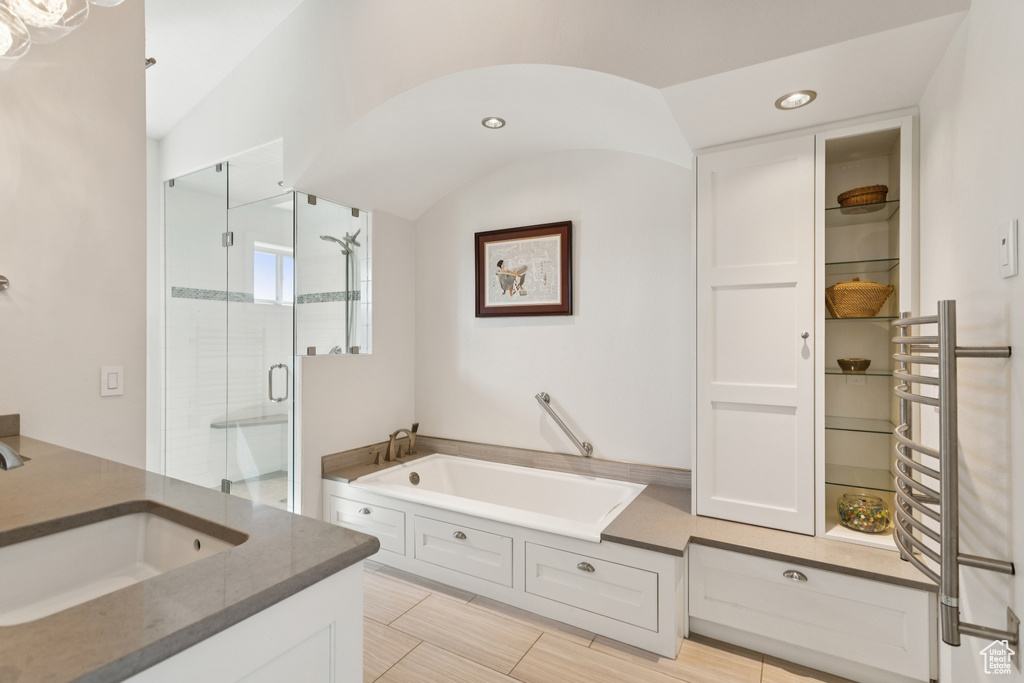 Bathroom featuring a garden tub, a stall shower, vanity, and recessed lighting