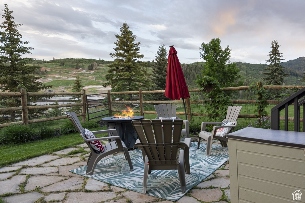 View of patio featuring a fire pit