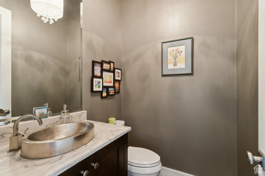 Bathroom with vanity and a chandelier