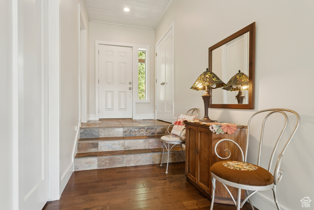 Foyer entrance with hardwood / wood-style flooring, recessed lighting, and ornamental molding