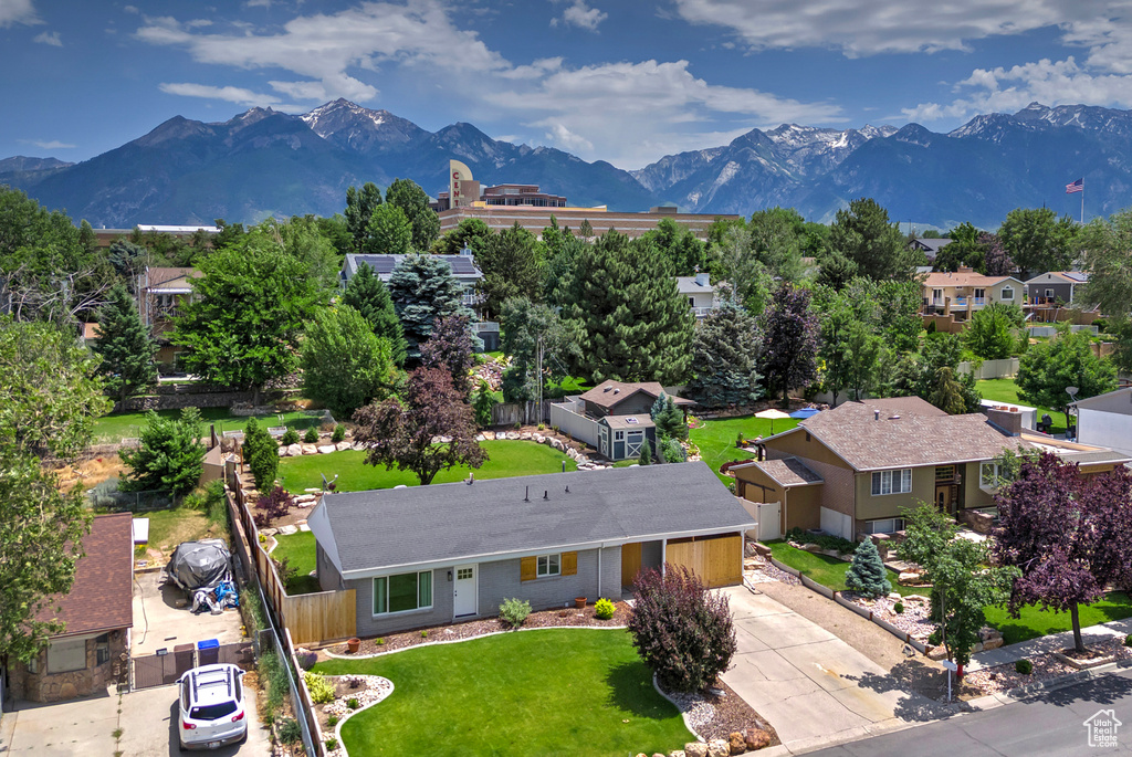 Aerial view of residential area featuring mountains