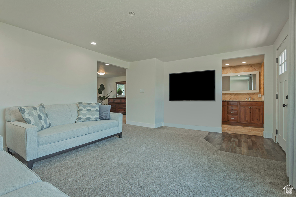 Living room featuring carpet floors and recessed lighting