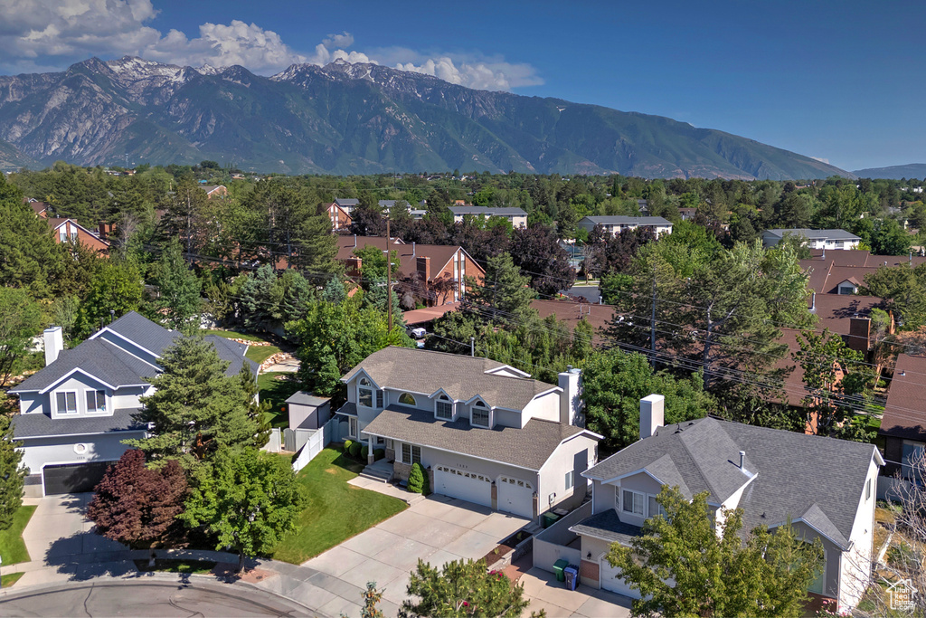 Aerial view of residential area with a mountainous background