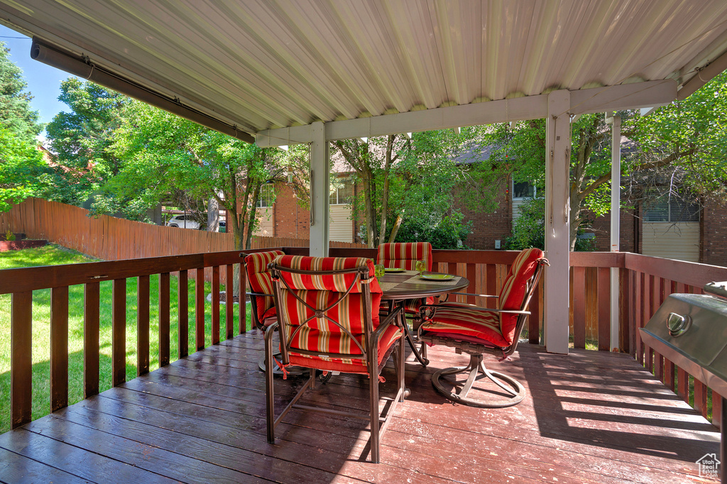 Wooden terrace featuring outdoor dining space