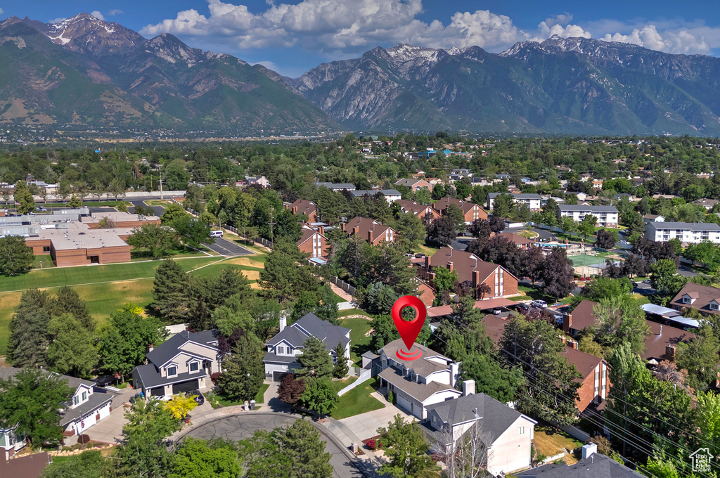 Aerial perspective of suburban area with a mountainous background