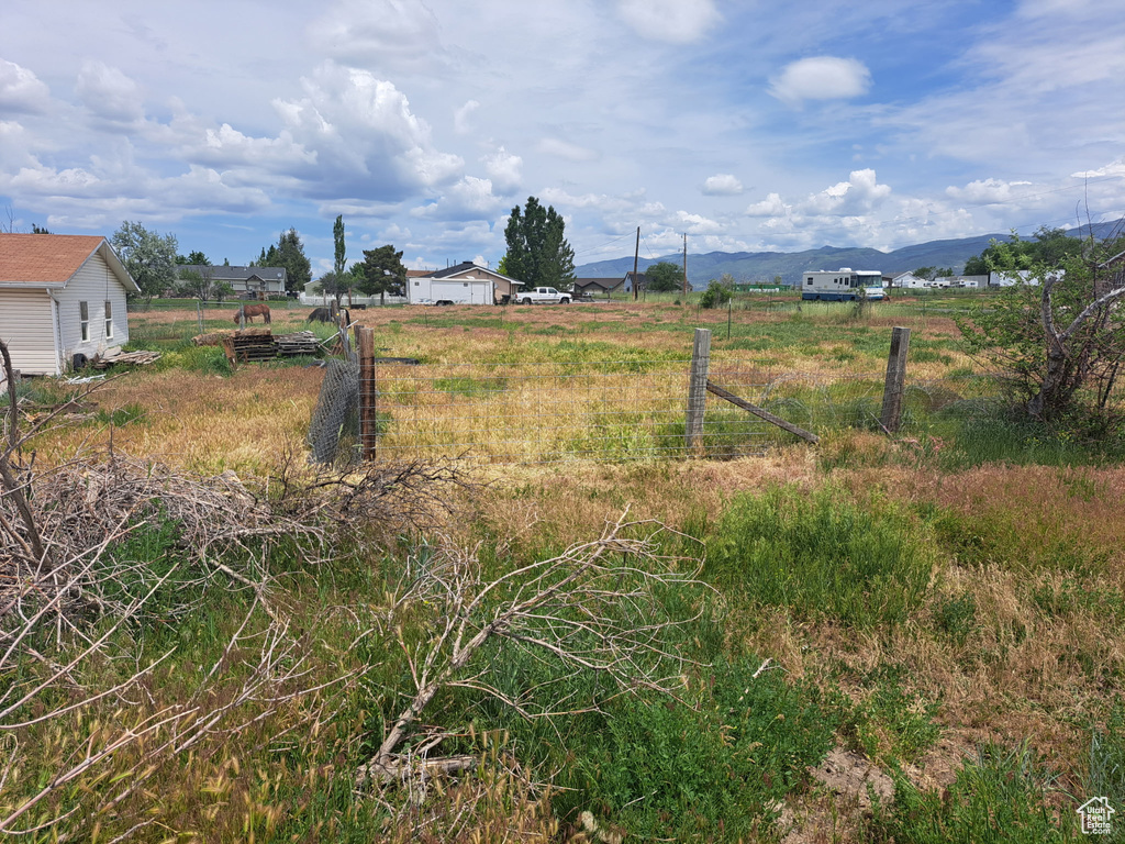 View of yard featuring a mountain view and a view of rural / pastoral area