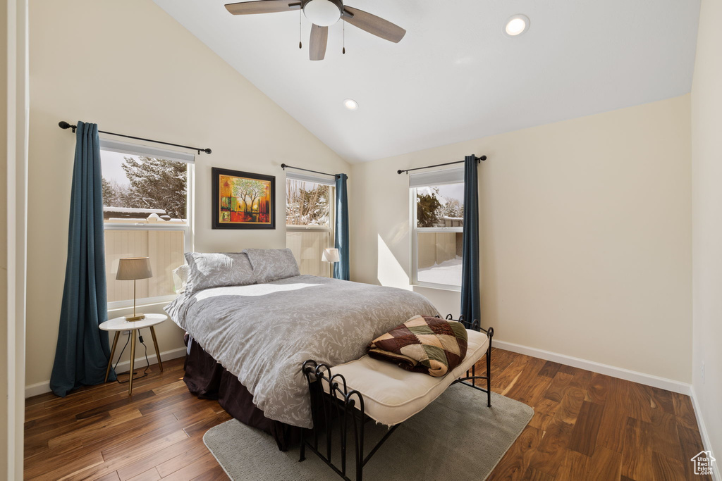 Bedroom with multiple windows, wood finished floors, recessed lighting, a ceiling fan, and high vaulted ceiling