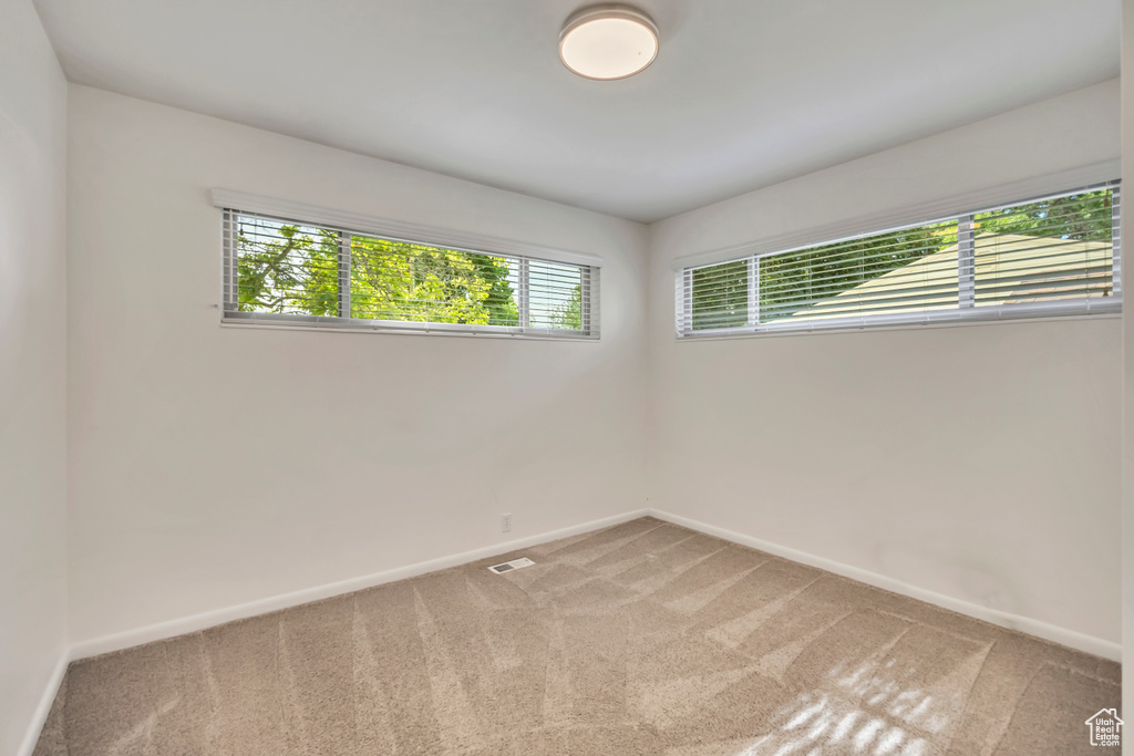 Unfurnished room featuring carpet