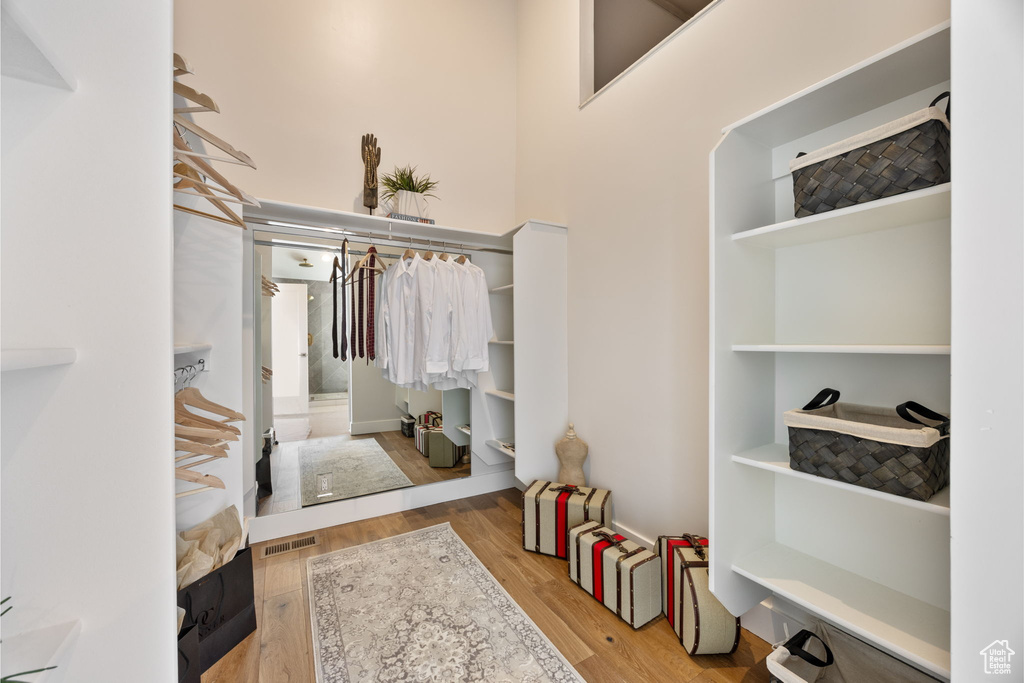 Walk in closet featuring wood finished floors