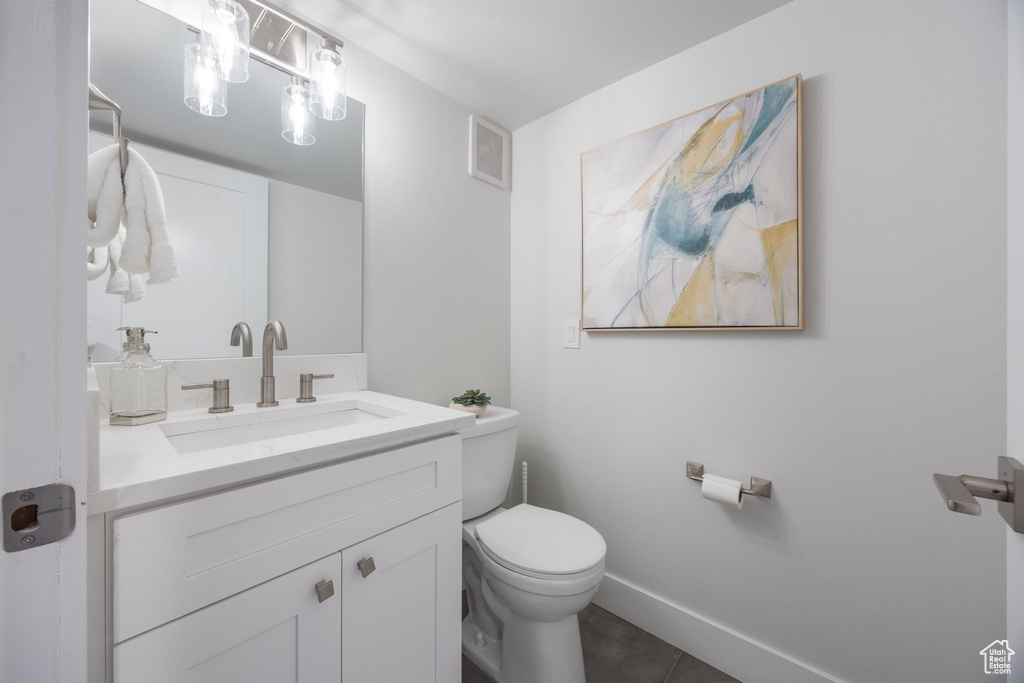 Bathroom featuring toilet and vanity