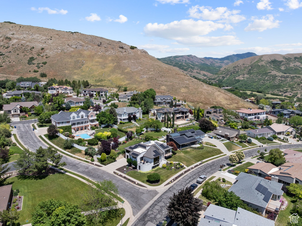 Aerial view of residential area featuring a mountain backdrop