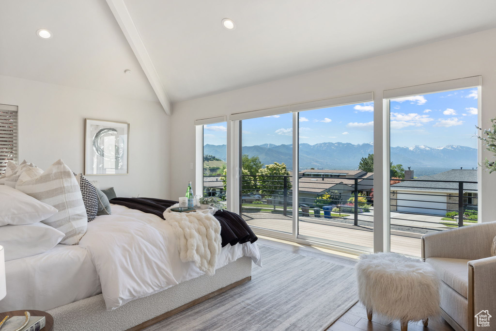 Bedroom with access to exterior, a mountain view, recessed lighting, and wood finished floors