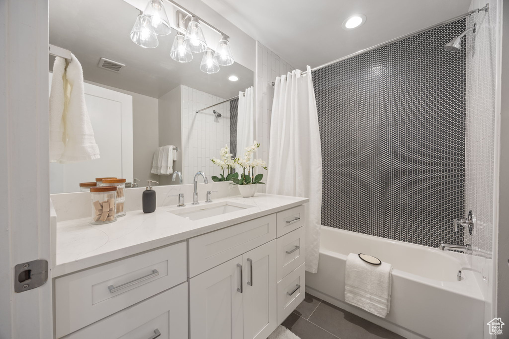 Full bath with vanity, shower / tub combo, tile patterned floors, and recessed lighting